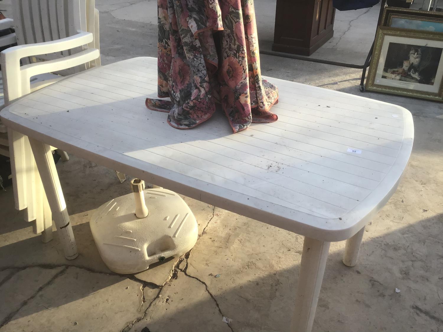 A WHITE PLASTIC GARDEN TABLE WITH FOUR MATCHING CHAIRS, A FLORAL PARASOL AND BASE - Image 2 of 4