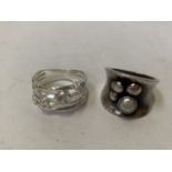 TWO SILVER DRESS RINGS