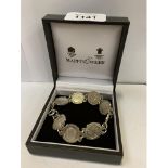 A BOXED SILVER COIN BRACELET