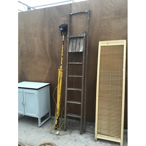 A VINTAGE FIVE RUNG WOODEN STEP LADDER AND AN INSPECTION LAMP