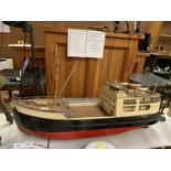 A HAND BUILT WOODEN ELECTRIC MOTOR BOAT MODEL, UNTESTED MOTOR