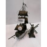 TWO UNUSUAL WHITE METAL ITEMS - BOAT AND WINDMILL, BOTH WITH INDISTINCT MARKS