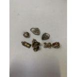 A COLLECTION OF SIX SILVER CHARMS