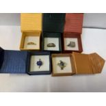 A COLLECTION OF FIVE BOXED DRESS RINGS