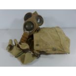 A MILITARY GAS MASK AND CASE