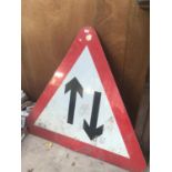 A LARGE TRIANGULAR ROAD SIGN