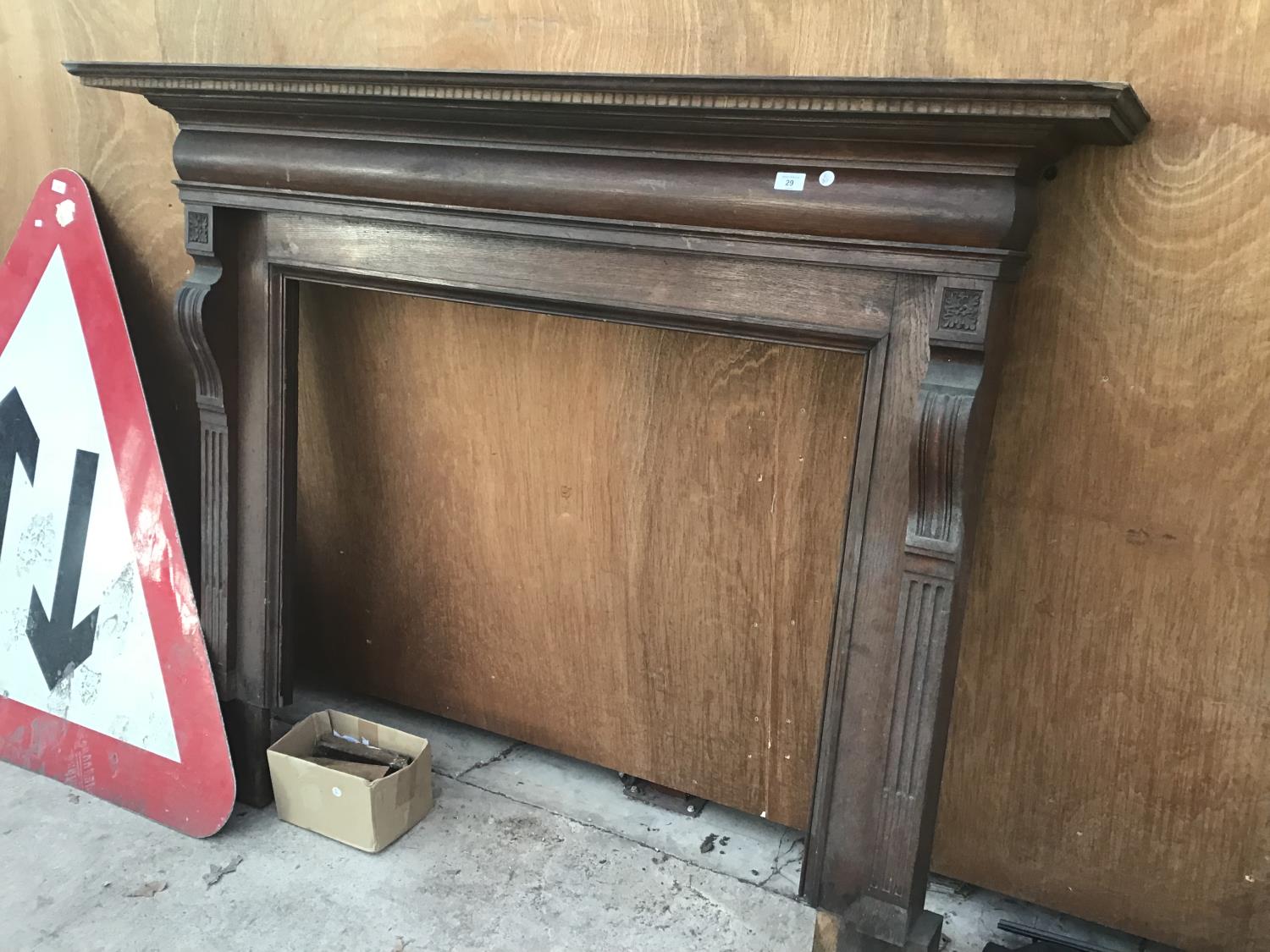 AN EDWARDIAN OAK FIRE SURROUND