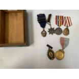 A BOX OF ASSORTED MEDALS