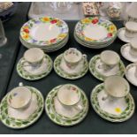 A COLLECTION OF GRINDLEY POTTERY CUPS, SAUCERS AND SIDE PLATES IN THE PATTERN 'PARTY TIME'