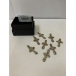 EIGHT SILVER CROSS CHARMS