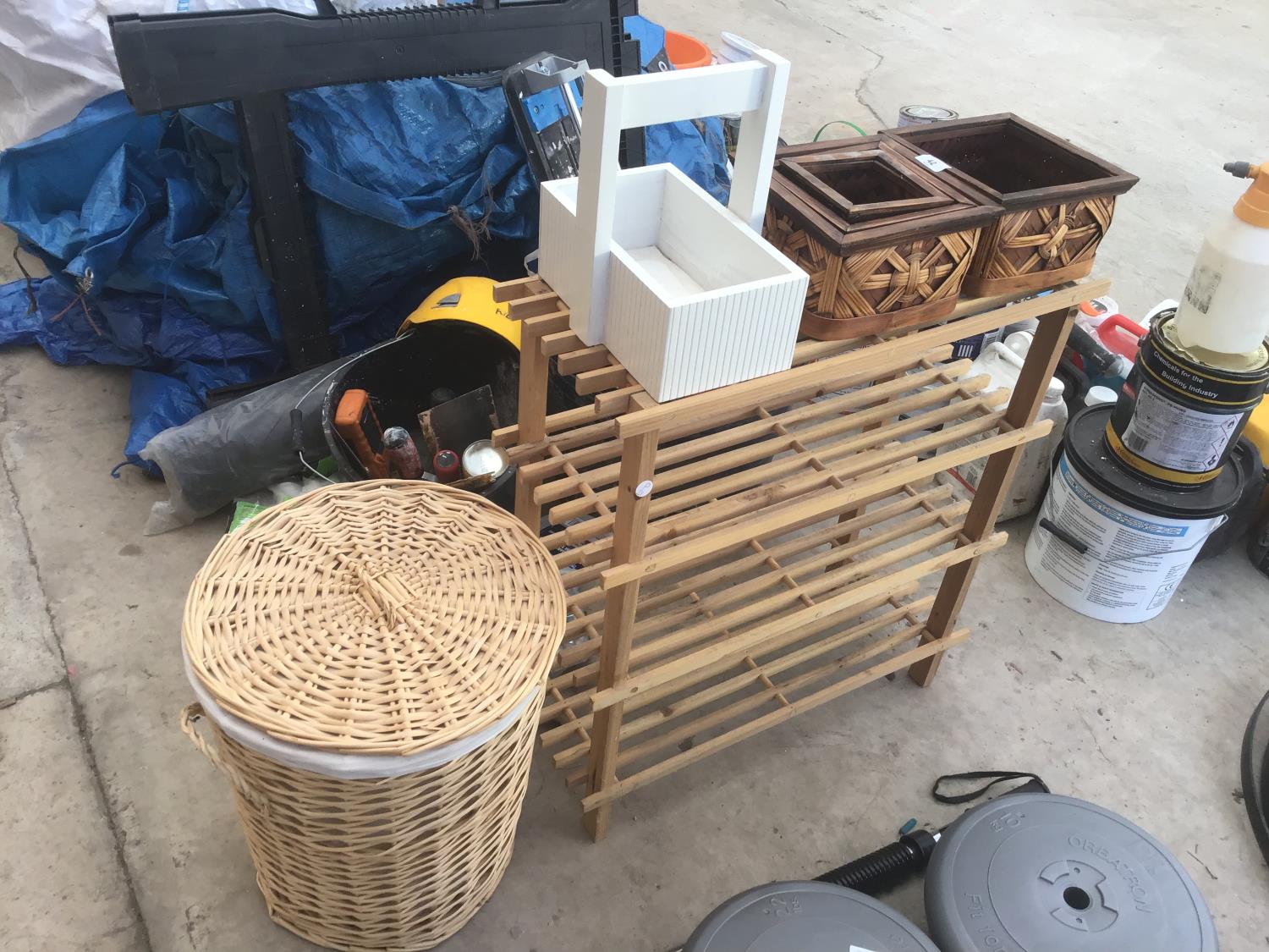 A WICKER LINEN BASKET, RACK, WOODEN BASKET AND FOUR FURTHER BASKETS