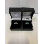 TWO BOXED LADIES SILVER RINGS WITH PURPLE AND BLUE STONE DESIGN