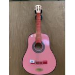 A SMALL CHILD'S PINK ACOUSTIC GUITAR