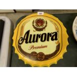 A METAL 'AURORA' BEER BOTTLE CAP SIGN, DIAMETER 35CM