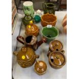 A COLLECTION OF ASSORTED POTTERY TO INCLUDE LIDDED JARS, JUG, CERAMIC WATER CAN MODEL ETC