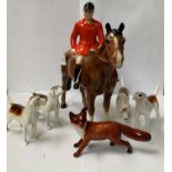 A BESWICK HUNTSMAN SET WITH FOUR BEAGLES AND A FOX FIGURE