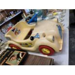 A CHILD'S PLASTIC NODDY CAR