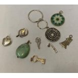 A COLLECTION OF ASSORTED SILVER NECKLACE FOBS/CHARMS