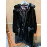 A LADIES LONG FUR COAT