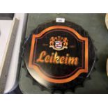 A METAL 'LEIKEIM' BEER BOTTLE CAP SIGN, DIAMETER 35CM