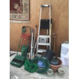 A LARGE COLLECTION OF GARDENING ITEMS TO INCLUDE HOSEPIPES, SPADES, EDGER, SHEARS, LAWN MOWER ETC
