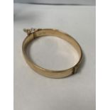A 9CT GOLD PLATED BANGLE IN BOX
