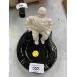 A CERAMIC MICHELIN MAN ASHTRAY