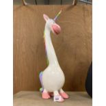 A PAINTED WOODEN MODEL OF A UNICORN