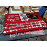 A COLLECTION OF ELVIS PRESLEY METAL BADGES AND BELTS