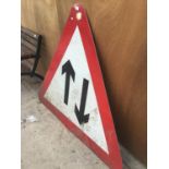 A LARGE TRIANGULAR ROAD SIGN