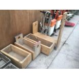 THREE WOODEN PLANTERS AND A WOODEN FRAME WITH STAR CUT OUTS