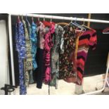 A COLLECTION OF NEW (SOME WITH TAGS) LADIES DRESSES (RAIL AND HANGERS NOT INCLUDED)