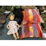 THREE PILLOWS TOGETHER WITH A BROKEN DOLL