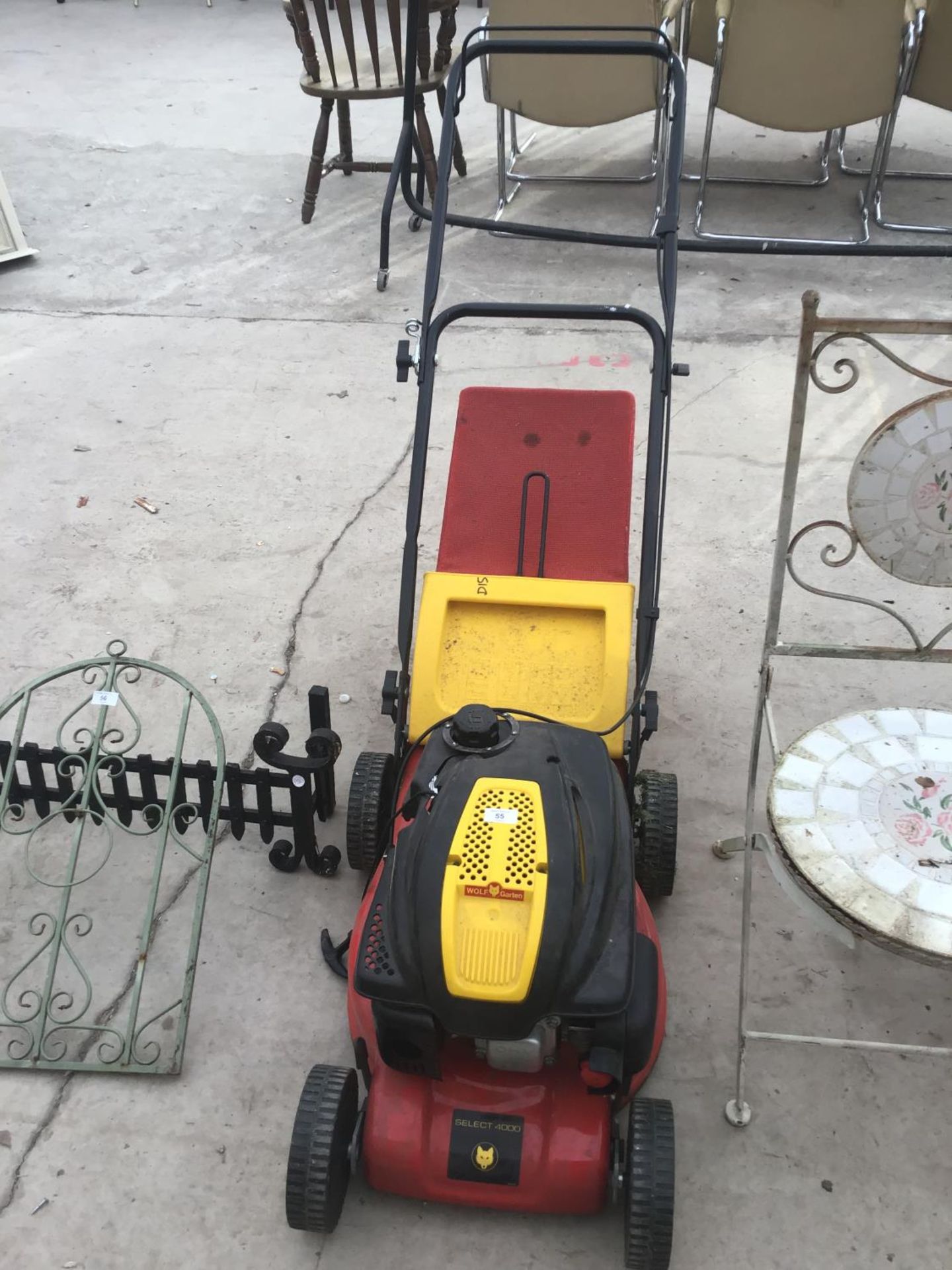 A WOLF GARTEN PETROL LAWN MOWER IN WORKING ORDER