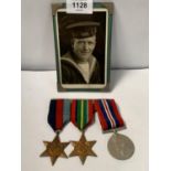 A COLLECTION OF THREE WWII MEDALS TOGETHER WITH A WAR TIME PHOTOGRAPH