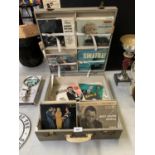 A VINTAGE RECORD DISPLAY CARRY CASE CONTAINING ASSORTED SINGLES