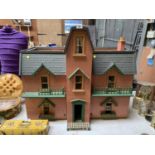 A LARGE DOLLS HOUSE WITH VARIOUS FURNISHING ACCESSORIES