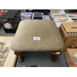 A SMALL UPHOLSTERED AND MAHOGANY FOOTSTOOL