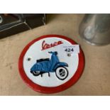 A SMALL CAST VESPA SIGN