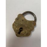 A SMALL BRASS PADLOCK