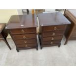 TWO STAG MINSTREL MAHOGANY BEDSIDE CHESTS OF FOUR DRAWERS