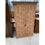 A PINE WARDROBE WITH TWO DOORS