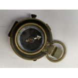 A 1917 CROWS FOOT BRASS COMPASS