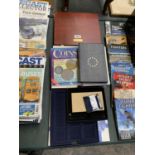 A GROUP OF COIN COLLECTOR BOOKS, DISPLAY CASES ETC