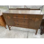 AN ARTS AND CRAFTS STYLE OAK SIDEBOARD WITH TWO DOORS AND THREE DRAWERS