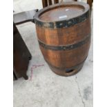 A SMALL BANDED OAK BARREL