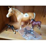 FOUR BESWICK CERAMIC HORSE MODELS - PALOMINO HORSE, AND THREE FOALS, ONE A/F