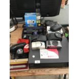 A MIXED GROUP OF ITEMS TO INCLUDE A CAMERAS, BOXED TORCH, SHARP VIDEO ETC