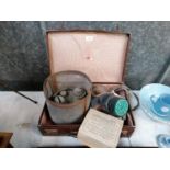 A SUITCASE CONTAINING A VINTAGE BOXED GAS MASK ETC