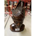 A WOODEN TRIBAL BUST